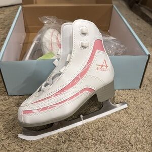 New girl’s pink and white ice skates